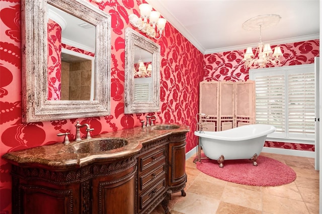 bathroom with tile floors, a bath to relax in, a chandelier, vanity with extensive cabinet space, and crown molding