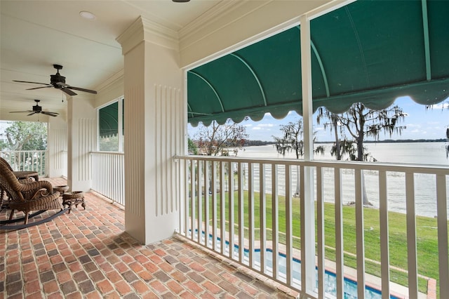 exterior space featuring a water view and ceiling fan