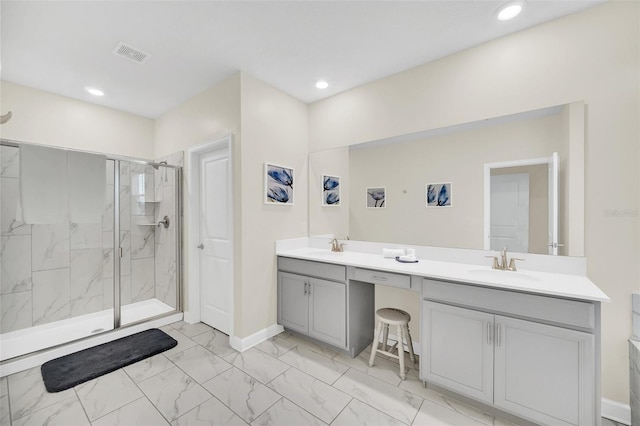 bathroom featuring an enclosed shower, double sink vanity, and tile floors