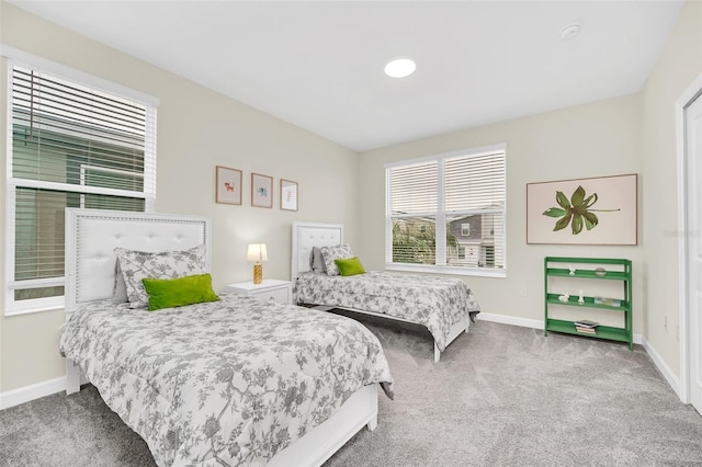 bedroom with light colored carpet