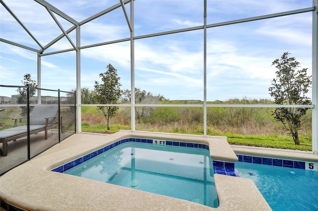 view of pool featuring a lanai and a patio area