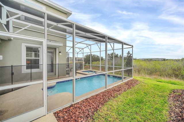 view of pool featuring an in ground hot tub and glass enclosure