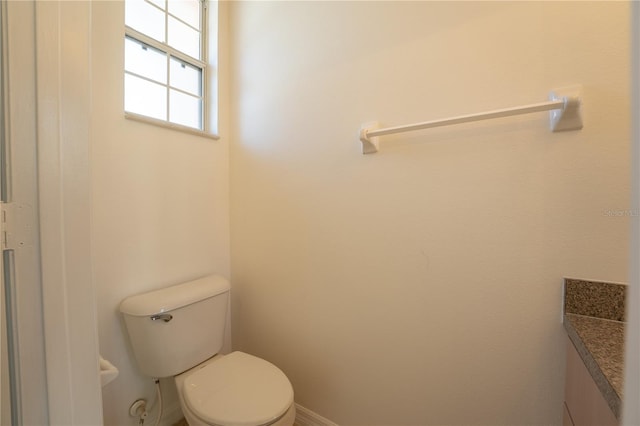 bathroom with toilet and vanity