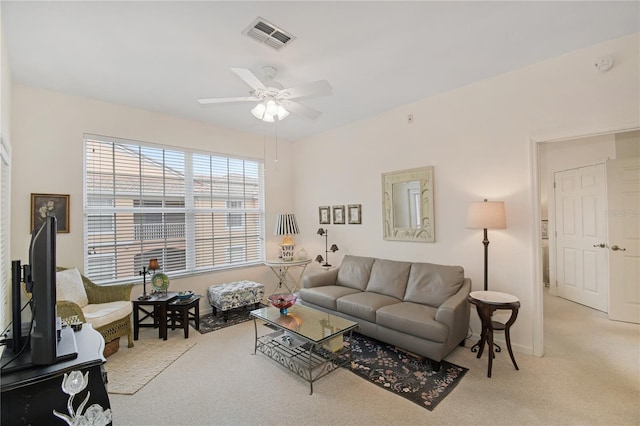 living room featuring light colored carpet and ceiling fan