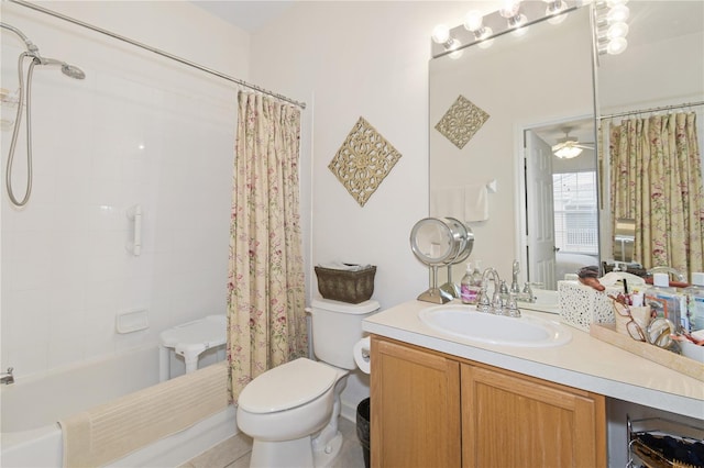 full bathroom featuring toilet, ceiling fan, tile patterned floors, vanity, and shower / bathtub combination with curtain