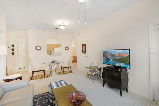 13524 Turtle Marsh Loop Unit 638, Orlando, FL 32837 - living room featuring arched walkways, ceiling fan, baseboards, and carpet floors