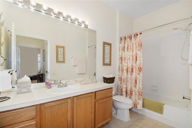 full bathroom featuring vanity, shower / tub combo with curtain, toilet, and tile patterned floors