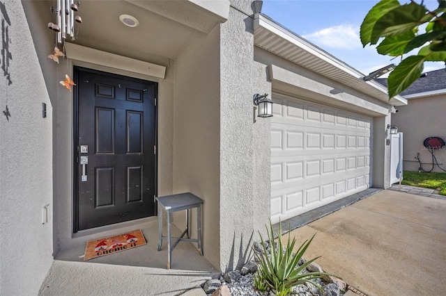 property entrance featuring a garage