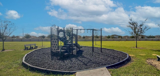 view of jungle gym with a lawn