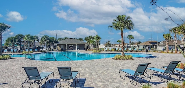 view of swimming pool featuring a patio area