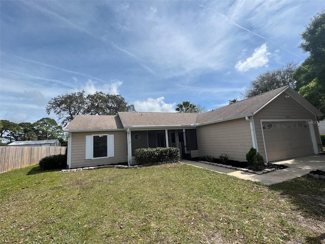 single story home featuring a garage and a front yard