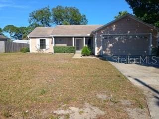 6425 Stillwater Ave, Cocoa, FL 32927 - ranch-style home featuring a garage, driveway, fence, and a front lawn