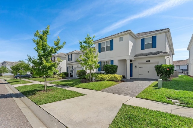 view of front of house featuring a front yard and a garage