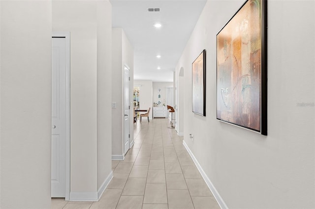 hallway featuring light tile flooring