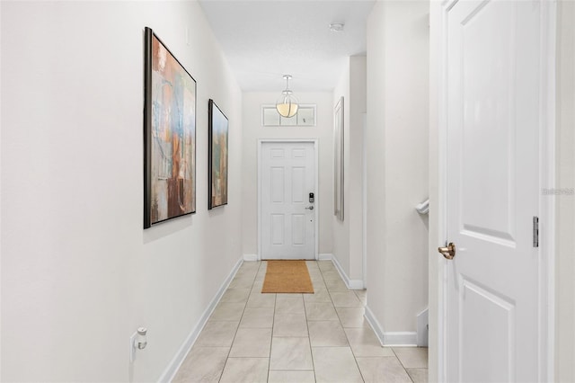 hall featuring light tile floors