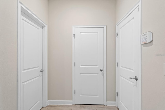 hallway with light tile floors