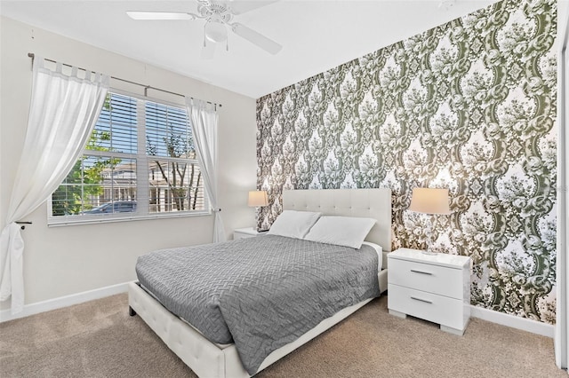 bedroom featuring light carpet and ceiling fan