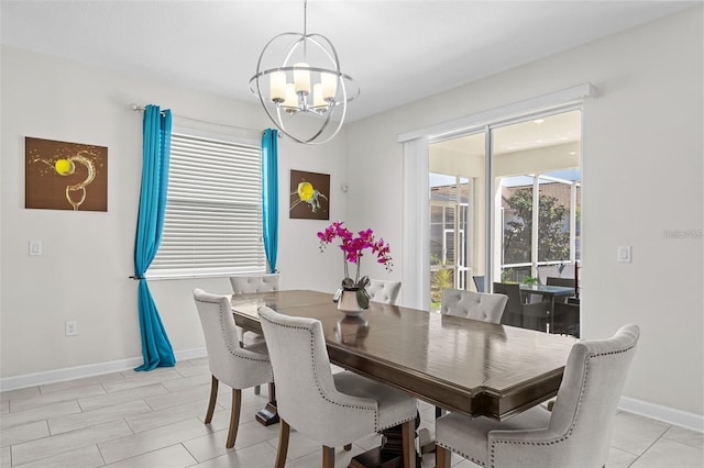 tiled dining room featuring an inviting chandelier