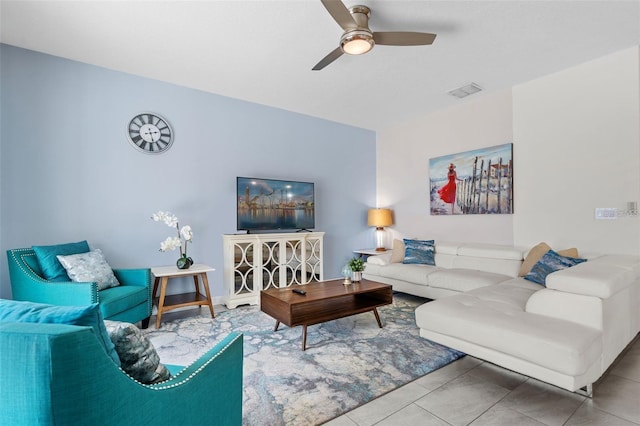 tiled living room featuring ceiling fan