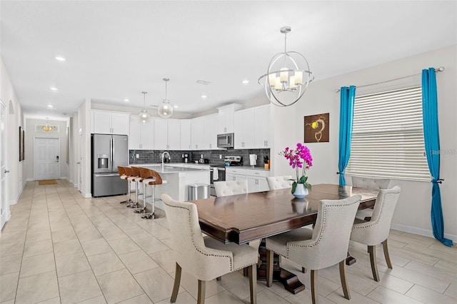 tiled dining space featuring an inviting chandelier