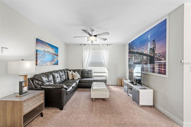 living room with ceiling fan and carpet