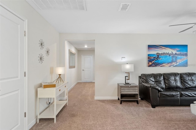 living room featuring light carpet and ceiling fan