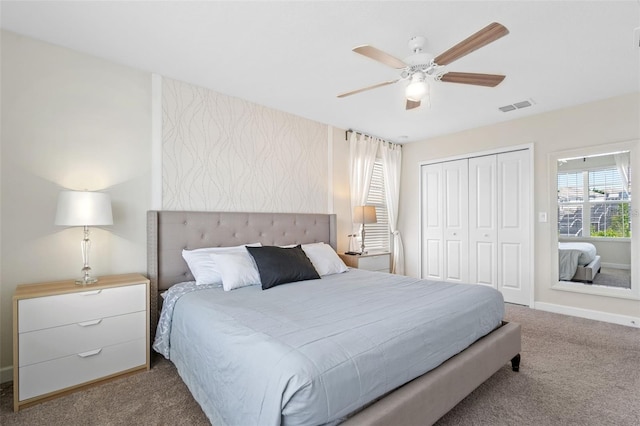 bedroom featuring a closet, light carpet, and ceiling fan