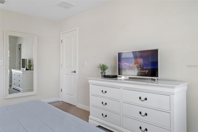 bedroom with light colored carpet