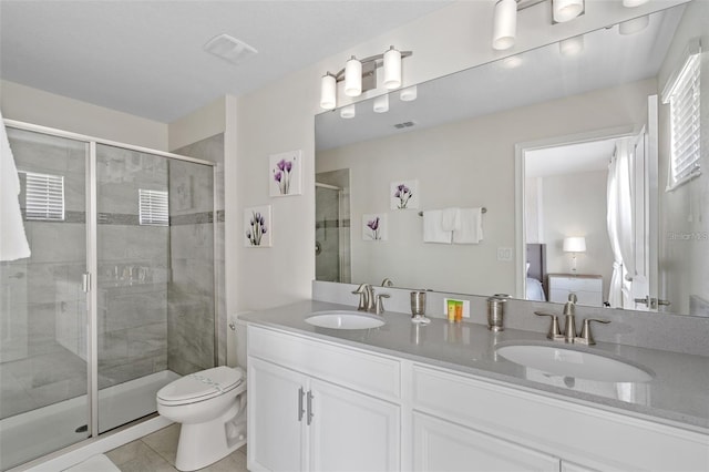 bathroom with walk in shower, toilet, tile floors, and dual vanity