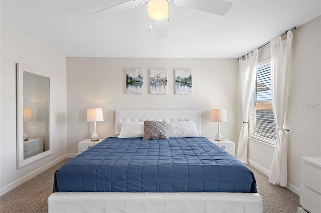 bedroom featuring light carpet, ceiling fan, and a textured ceiling