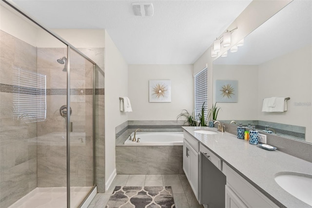 bathroom featuring tile floors, dual bowl vanity, and separate shower and tub