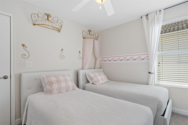 carpeted bedroom featuring ceiling fan