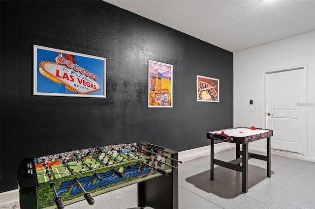 playroom featuring a textured ceiling