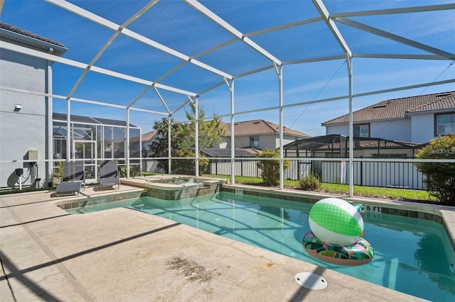 view of pool featuring an in ground hot tub, a lanai, and a patio area