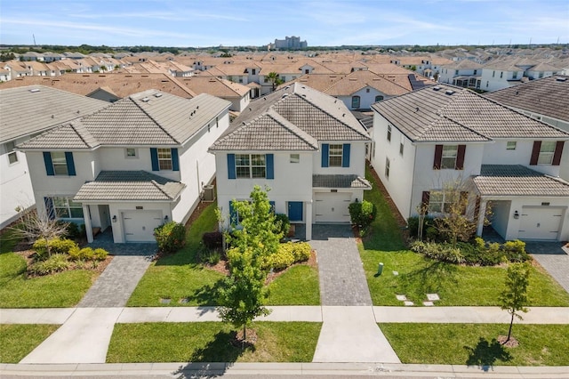 view of front of house featuring a front lawn and a garage