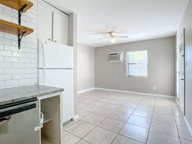 kitchen featuring light tile floors, ceiling fan, white fridge, and stainless steel dishwasher