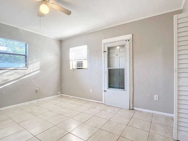 tiled spare room with ceiling fan