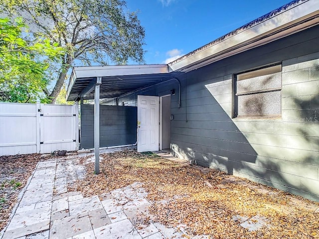 doorway to property with a patio area