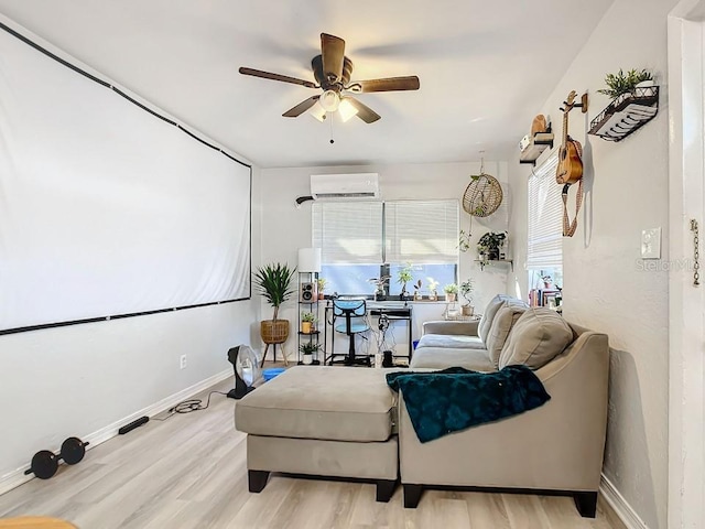 interior space with light hardwood / wood-style floors, ceiling fan, and an AC wall unit