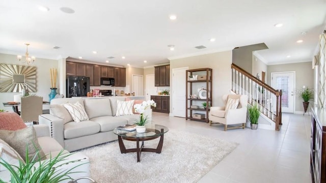 living room featuring crown molding, light tile patterned floors, and a notable chandelier