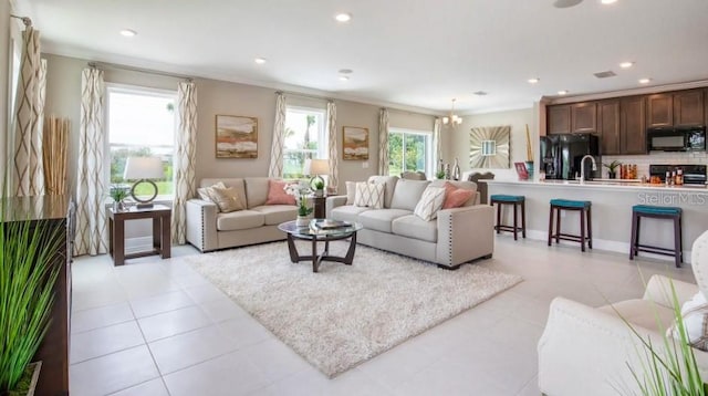 living room featuring light tile patterned flooring and crown molding