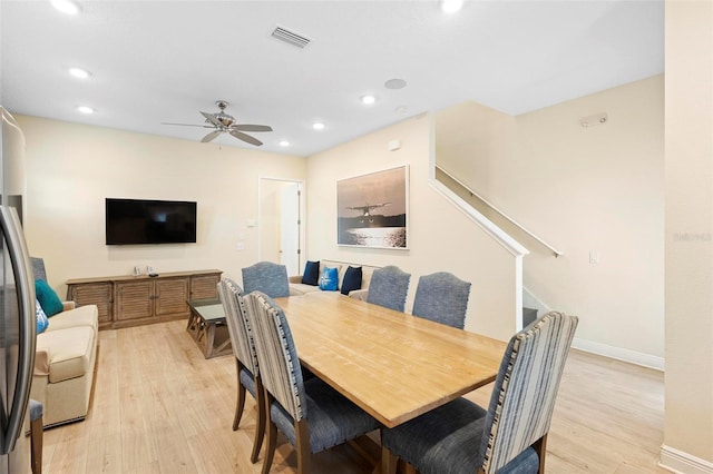 dining space featuring ceiling fan and light hardwood / wood-style flooring