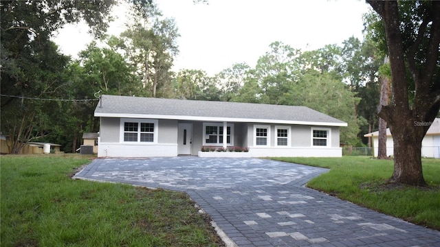 ranch-style house with a front yard