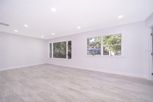 spare room with light hardwood / wood-style flooring