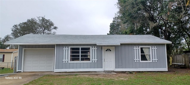 ranch-style home featuring a garage