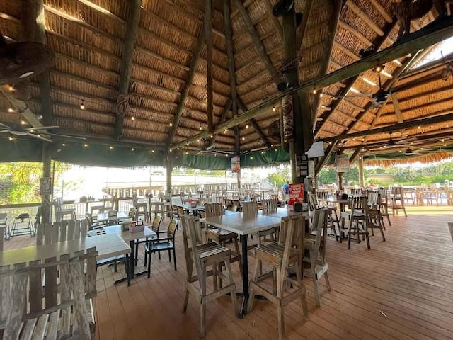 exterior space with vaulted ceiling and dark wood-type flooring