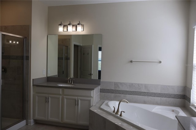 bathroom featuring vanity, plus walk in shower, and tile flooring