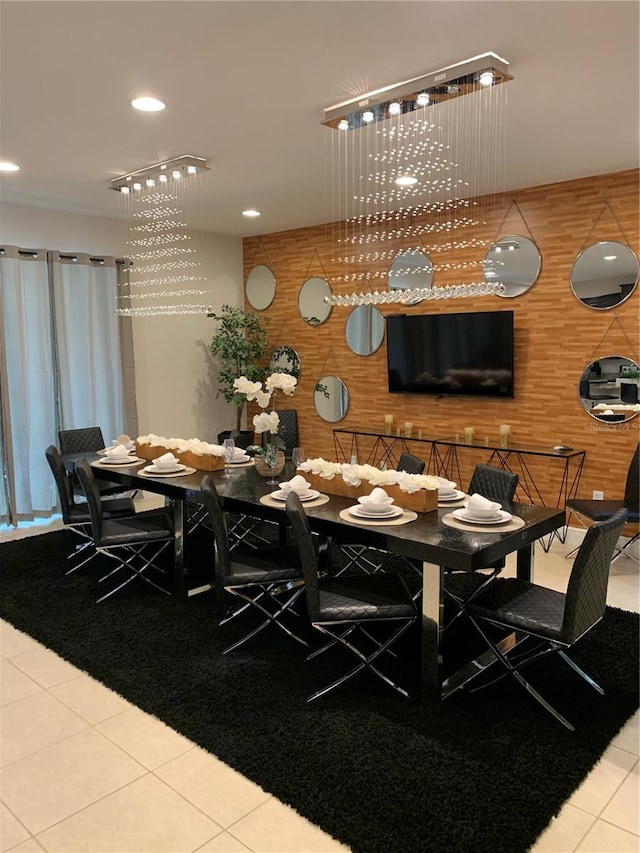 dining area with wooden walls and tile patterned flooring