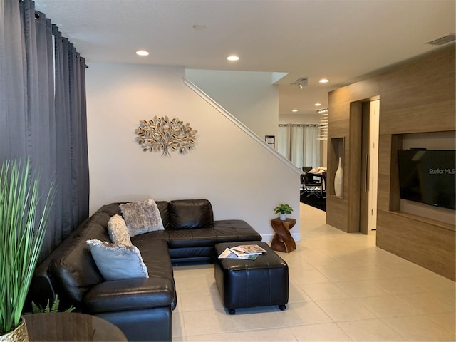 living room with light tile patterned flooring