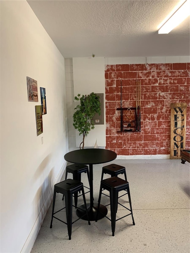 dining area with a textured ceiling